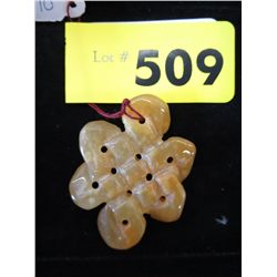 Carved amber coloured jade . 2" x 1.5"