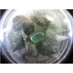 1 polished & four rough cut emeralds
