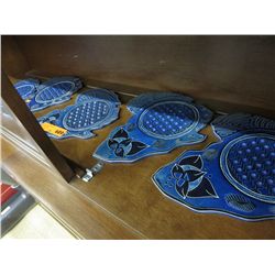 Five carved soapstone trivets
