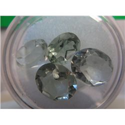 Four cut light green amethysts.