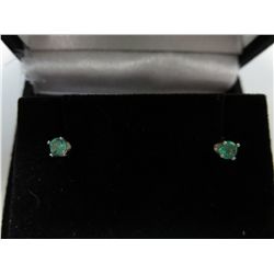 South American round cut emerald earrings.
