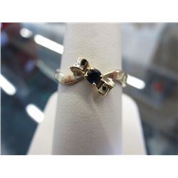Sapphire ring, off-set ribbon design