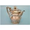 Image 1 : A George IV silver hotwater pot with demi-fluted lid and body with shell and gadrooned borders an...