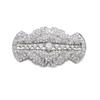 Image 1 : AN ART DECO DIAMOND BROOCH Designed as a shaped openwork oval plaque with fan-shaped terminals, s...