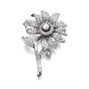 Image 1 : Property of a Lady A DIAMOND FLOWER BROOCH The center, set throughout with baguette and circular-...