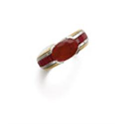 Property of a Lady A RUBY RING The oval-shaped ruby weighing approximately 2.10 carats to calibre...