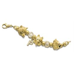 A GOLD AND DIAMOND BRACELET Designed as three 18K gold sculpted Husky Dog heads with colored ston...