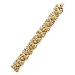 Property of a European estate A GOLD AND DIAMOND BRACELET The flexible band, designed as a series...