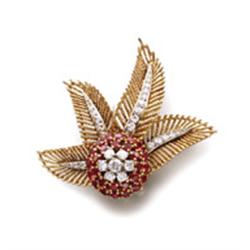 BOUCHERON A GOLD, DIAMOND AND RUBY BROOCH Of floral and foliate motif, the flower set with brilli...