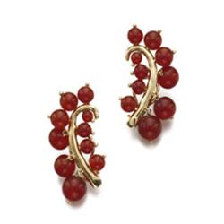 SEAMAN SCHEPPS A PAIR OF GOLD AND CARNELIAN EARCLIPS Each designed as a stylized feather, set wit...