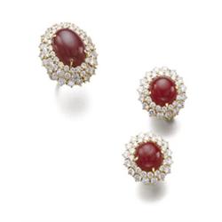 Property of a European estate A SET OF RUBY AND DIAMOND JEWELRY Comprising a ring, set with an ov...