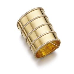ADLER A GOLD AND DIAMOND BANGLE The large 18K polished gold cuff enhanced by five lines set with ...