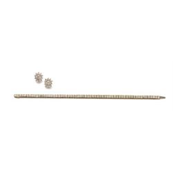 A DIAMOND LINE BRACELET AND A PAIR OF DIAMOND EARRINGS The bracelet, set with square-cut diamonds...