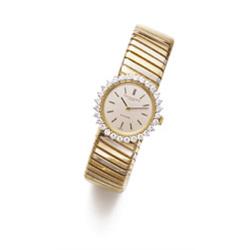 Property of a Lady BULGARI A GOLD AND DIAMOND LADY'S WRISTWATCH The circular-shaped cream dial wi...
