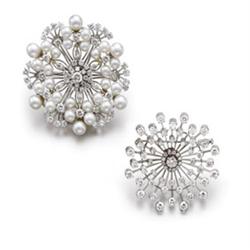 A DIAMOND BROOCH The stylized sun, set with four staggered rows of circular-cut diamonds on knife...
