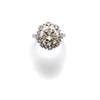 Image 1 : A DIAMOND RING The brilliant-cut diamond weighing 4.56 carats within a surround of similarly cut ...