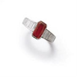 A RUBY AND DIAMOND RING The rectangular-cut ruby weighing 2.11 carats to the tapering shoulders s...