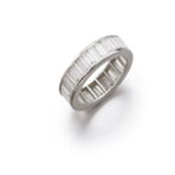 A DIAMOND ETERNITY RING Channel-set with 34 baguette-cut diamonds weighing approximately 4.00 car...