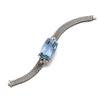 Image 1 : AN AQUAMARINE AND DIAMOND BRACELET Centering upon a shaped rectangular-cut aquamarine and enhance...