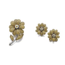 A SET OF YELLOW SAPPHIRE AND DIAMOND JEWELRY Comprising a brooch, designed as a flower, the petal...