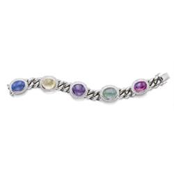 Property of a lady of title A WHITE GOLD, MULTI-COLORED SAPPHIRE, EMERALD AND DIAMOND BRACELET De...