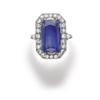 Image 1 : A SAPPHIRE AND DIAMOND RING Designed as a rectangular-cut sapphire weighing approximately 10.80 c...