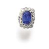 Image 1 : A SAPPHIRE AND DIAMOND RING The oval-shaped sapphire weighing 8.59 carats within a surround of br...