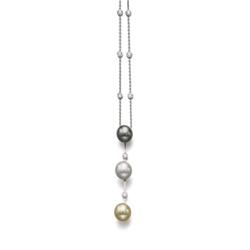 A MULTI-COLORED CULTURED PEARL AND DIAMOND PENDANT NECKLACE Designed as a line set with black, wh...