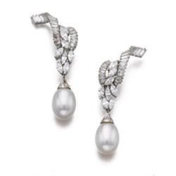 A PAIR OF CULTURED PEARL AND DIAMOND EARPENDANTS Each of scroll design, set with marquise and bag...