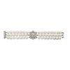 Image 1 : A CULTURED PEARL AND DIAMOND BRACELET Designed as three rows of cultured pearls and centering upo...