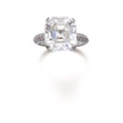 A DIAMOND RING The octagonal-shaped diamond weighing 8.21 carats to the diamond set gallery and s...