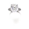 Image 1 : A DIAMOND RING The octagonal-shaped diamond weighing 8.21 carats to the diamond set gallery and s...