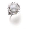 Image 1 : A NATURAL PEARL AND DIAMOND RING Designed as a natural white bouton pearl within a surround of ma...