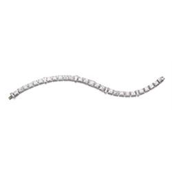 A DIAMOND LINE BRACELET Designed as a flexible line set with 26 rectangular-cut diamonds weighing...