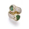 Image 1 : AN EMERALD AND DIAMOND RING Of crossover design, set with two heart-shaped emeralds weighing appr...