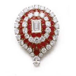 VAN CLEEF & ARPELS A DIAMOND AND RUBY CLIP BROOCH Designed as a rectangular-cut diamond weighing ...