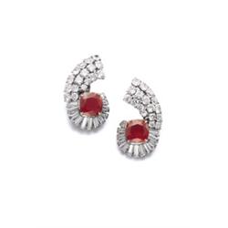 A PAIR OF RUBY AND DIAMOND EARCLIPS Each of scroll design, set with a cushion-shaped ruby weighin...