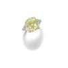 Image 1 : A RARE AND ATTRACTIVE FANCY YELLOW-GREEN DIAMOND RING The fancy yellow-green cushion-shaped diamo...