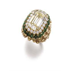 DAVID WEBB A FANCY YELLOW DIAMOND AND EMERALD RING The rectangular-cut fancy yellow diamond weigh...