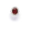 Image 1 : A RED SPINEL AND DIAMOND RING The oval-shaped red spinel weighing 6.90 carats within a surround o...