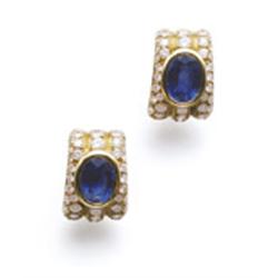BULGARI A PAIR OF SAPPHIRE AND DIAMOND EARCLIPS Each designed as an oval-shaped sapphire applied ...