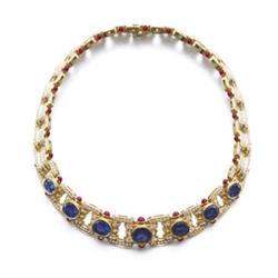 BULGARI A GOLD, SAPPHIRE, DIAMOND AND RUBY NECKLACE The flexible tapering band designed as a seri...