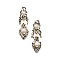 A PAIR OF ANTIQUE PEARL AND DIAMOND EARPENDANTS Each set with a pearl within a table-cut diamond ...