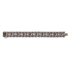 AN ANTIQUE DIAMOND, RUBY AND PEARL BRACELET Designed as a line of old mine-cut diamonds alternati...