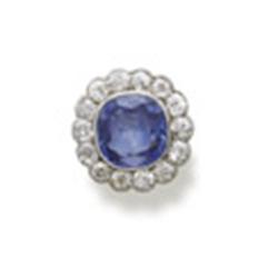 A SAPPHIRE AND DIAMOND RING Designed as a cushion-shaped sapphire weighing approximately 5.50 car...