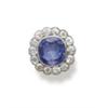 Image 1 : A SAPPHIRE AND DIAMOND RING Designed as a cushion-shaped sapphire weighing approximately 5.50 car...