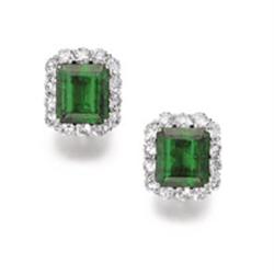 AN IMPRESSIVE PAIR OF EMERALD AND DIAMOND EARCLIPS Each set with a rectangular-cut emerald weighi...