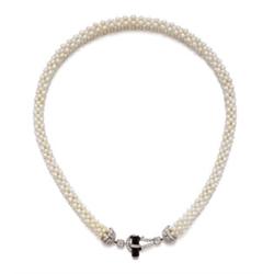 AN ART DECO SEED PEARL, ONYX AND DIAMOND NECKLACE Composed of seed pearls arranged in a lattice-w...