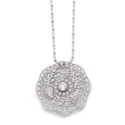 A PLATINUM AND DIAMOND PENDANT NECKLACE The circular-shaped pierced plaque with diamond set flora...