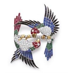 AN EXQUISITE ART DECO MULTI-GEM BROOCH Modeled as two maccaws perched on a diamond set branch, th...